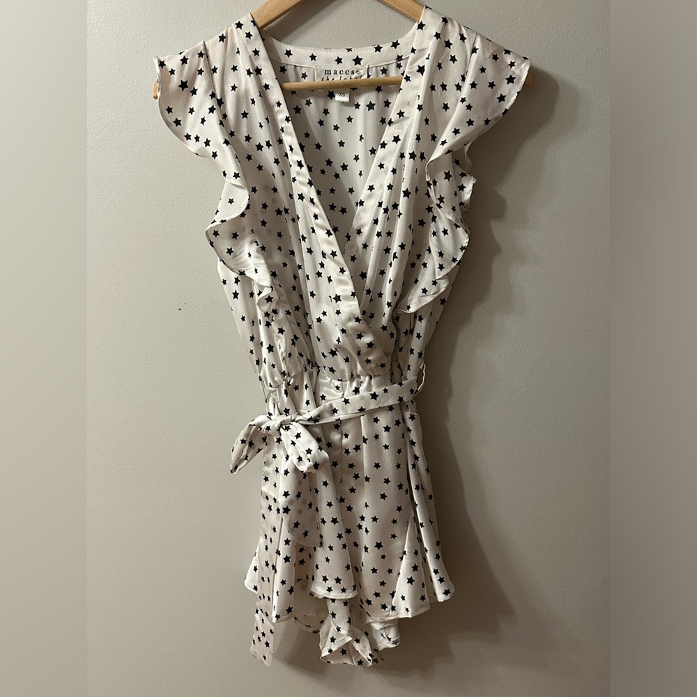 White romper with black stars size xs